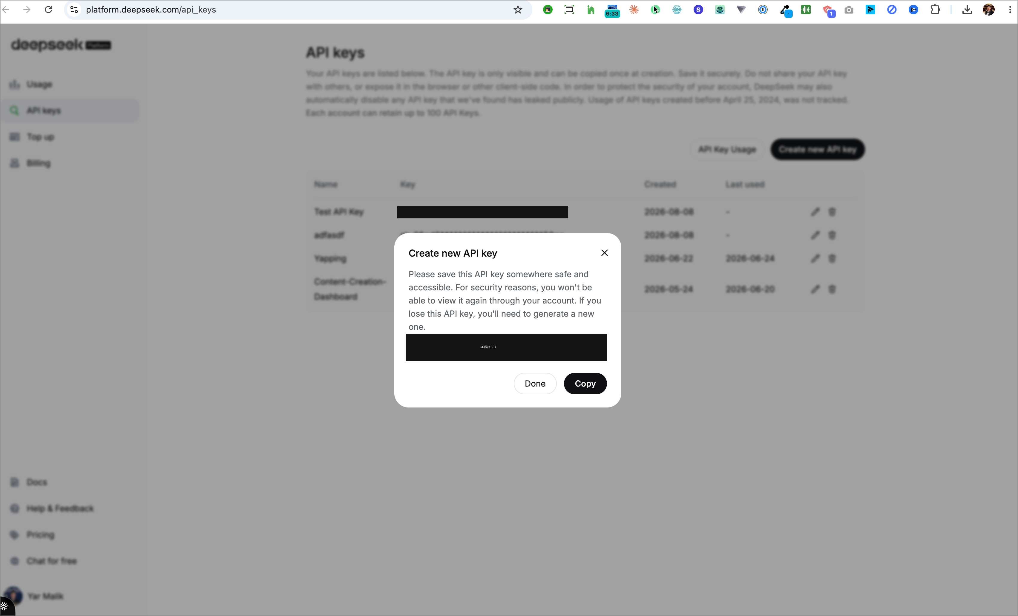 DeepSeek platform create-new-API-key dialog, with the key itself blacked out